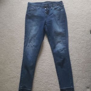 Button fly skinny jeans